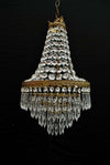 A beautiful crystal 1940's crystal pendant light, it is made of brass.