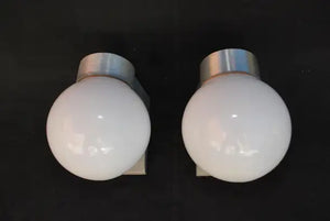 Sexy and rare pair of 1960's outdoor sconces