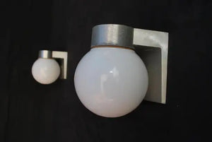 Sexy and rare pair of 1960's outdoor sconces