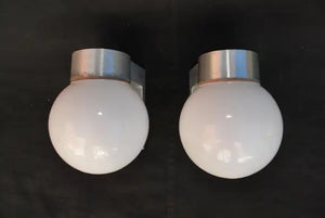 Sexy and rare pair of 1960's outdoor sconces