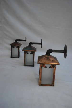 Set of three turn of the century copper outdoor sconces