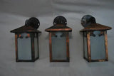 Set of three turn of the century copper outdoor sconces