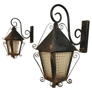 Elegant pair of 1940's French wrought iron outdoor sconces