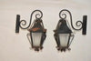 Elegant pair of 1940's French wrought iron outdoor sconces
