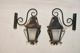 Elegant pair of 1940's French wrought iron outdoor sconces