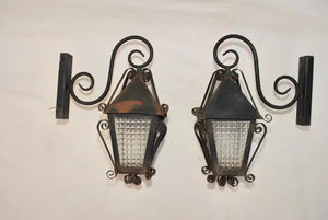 Elegant pair of 1940's French wrought iron outdoor sconces