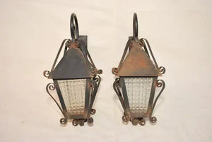 Elegant pair of 1940's French wrought iron outdoor sconces
