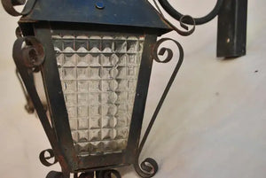 Elegant pair of 1940's French wrought iron outdoor sconces