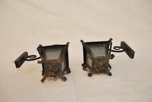 Elegant pair of 1940's French wrought iron outdoor sconces