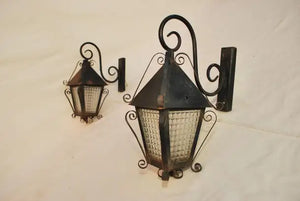 Elegant pair of 1940's French wrought iron outdoor sconces