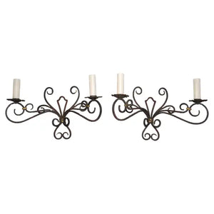 Rare large pair of French wrought iron sconces