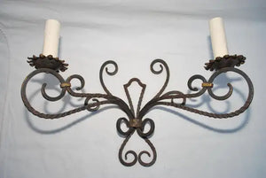 Rare large pair of French wrought iron sconces