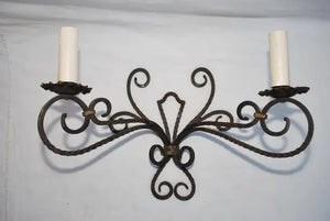 Rare large pair of French wrought iron sconces