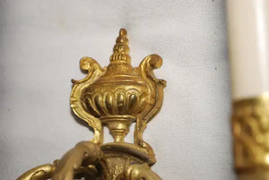 Elegant pair of French bronze sconces