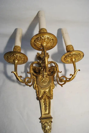 Elegant pair of French bronze sconces