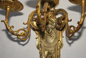 Elegant pair of French bronze sconces