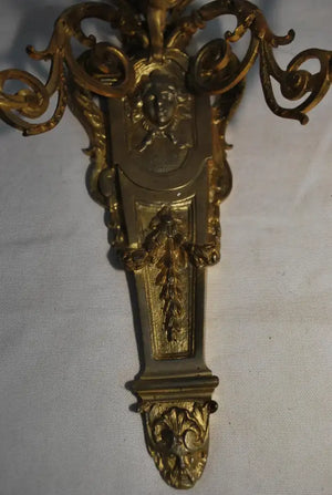 Elegant pair of French bronze sconces