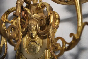Elegant pair of French bronze sconces