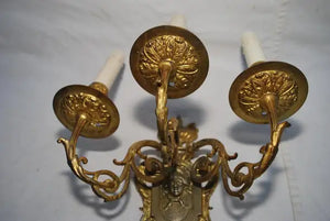Elegant pair of French bronze sconces