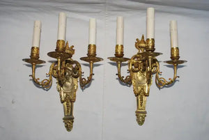 Elegant pair of French bronze sconces