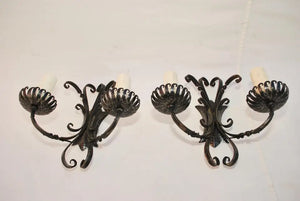 Elegant pair of French wrought iron sconces