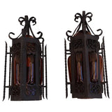 Pair of wrought iron sconces with hands blown glass