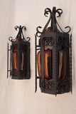 Pair of wrought iron sconces with hands blown glass