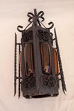 Pair of wrought iron sconces with hands blown glass