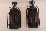 Pair of wrought iron sconces with hands blown glass