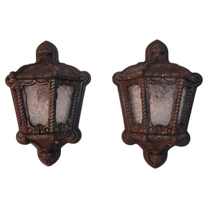 Rare pair of 1920's cast iron outdoor sconces