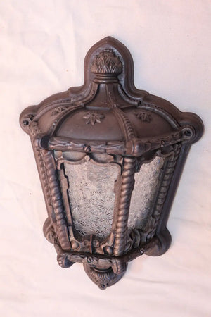 Rare pair of 1920's cast iron outdoor sconces