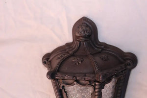 Rare pair of 1920's cast iron outdoor sconces