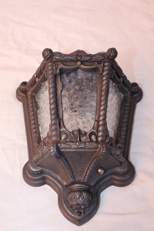Rare pair of 1920's cast iron outdoor sconces
