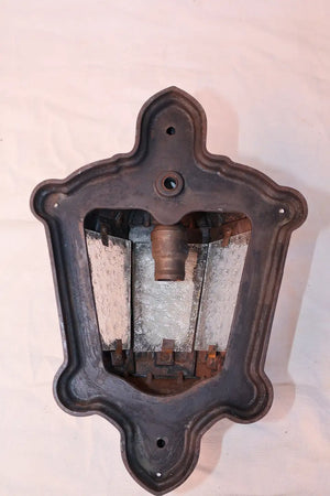 Rare pair of 1920's cast iron outdoor sconces