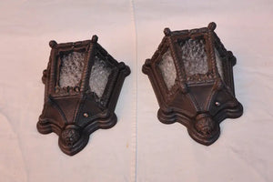 Rare pair of 1920's cast iron outdoor sconces