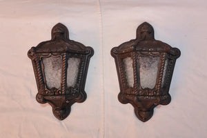 Rare pair of 1920's cast iron outdoor sconces