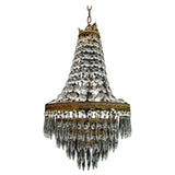 A beautiful crystal 1940's crystal pendant light, it is made of brass.