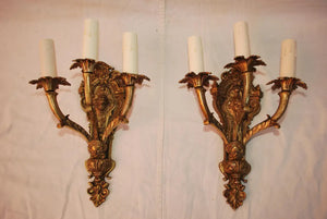 Elegant pair of French 1940''s Brass sconces with cupids