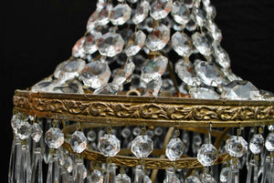 A beautiful crystal 1940's crystal pendant light, it is made of brass.