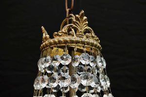 A beautiful crystal 1940's crystal pendant light, it is made of brass.
